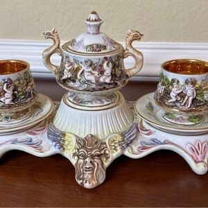 Ornate Ceramic Tea Set with Cherub Design